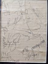 A mounted and framed and glazed sheet of paper containing the signatures of the 1995 England Rugby