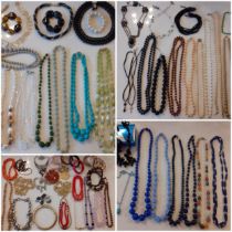A quantity of vintage costume jewellery, mainly bead necklaces to include a 3-strand Aurora Borealis