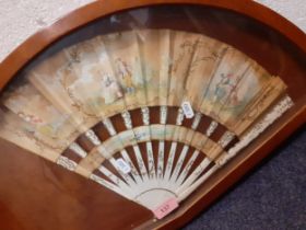 A late 19th/early 20th Century painted fan A/F with images of a courting couple sealed in a mahogany