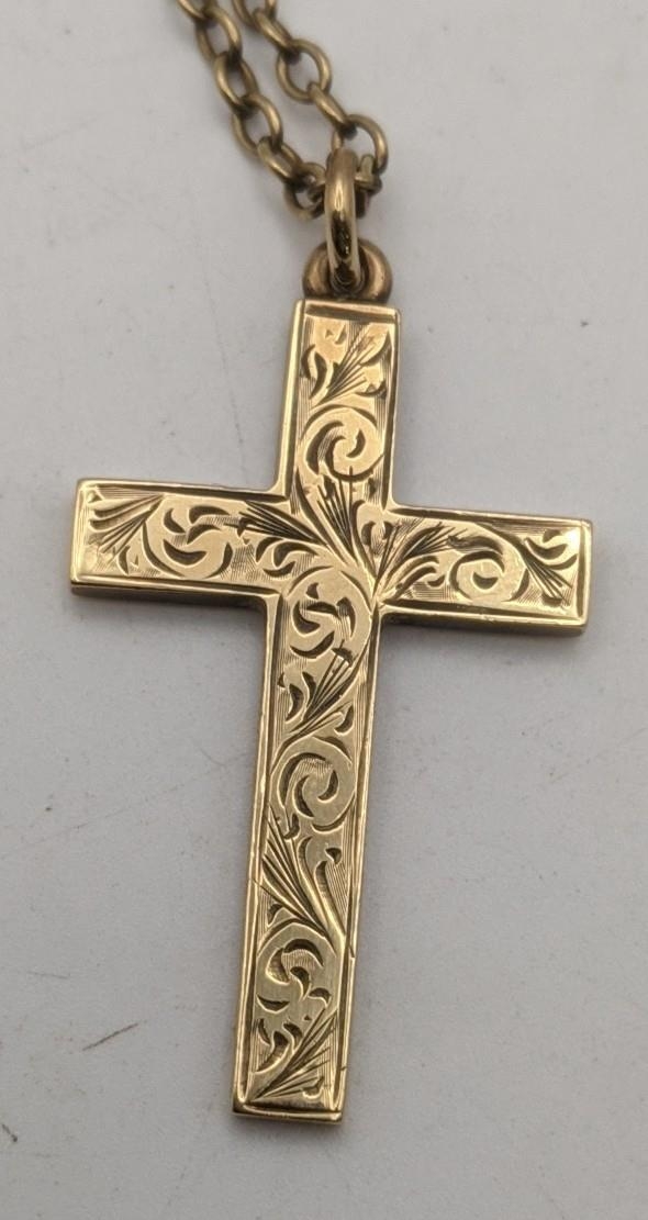 A 9ct gold cross pendant having a floral engraved design, on a gold necklace, tested as 9ct gold, - Image 2 of 2