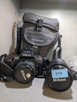 A Nikon N8008s AF camera with a 70-210mm and 35.70mm lens Location: