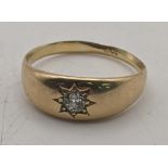 An 18ct gold starburst gypsy ring with a central diamond 4.1g Location: