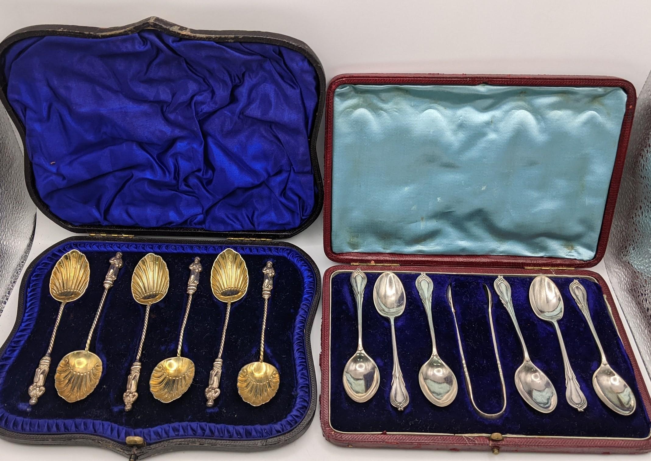 A set of silt gilt teaspoons with figural terminals and a set of six teaspoons and matching sugar