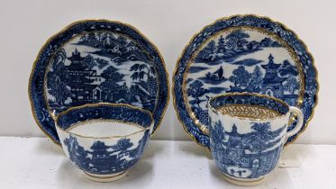 Two late 18th century Caughley blue and white tea bowls and saucers to include one set in the '