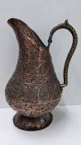 A Persian Qajar copper repousse jug 32.5cm h Location: