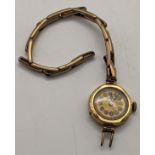 A 18ct gold ladies manual wind wristwatch A/F, on a later gold plated bracelet, total weight 15.4g