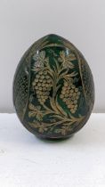 A Faberge style green glass egg with gilt painted floral and grapevine decoration, 8cm h Location: