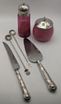 Mixed silver items to include a silver topped sugar caster with cranberry glass, along with a silver