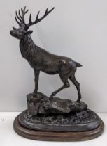 After Pierre-Jules Mene (1810-1879) - a bronze model of a stag stood atop a rocky outcrop and raised