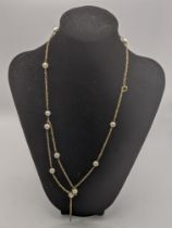 A gold and pearl necklace stamped 14k total weight 11.3g Location: