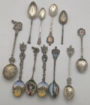 Silver and white metal collector's spoons to include four white metal gilt teaspoons having enamel