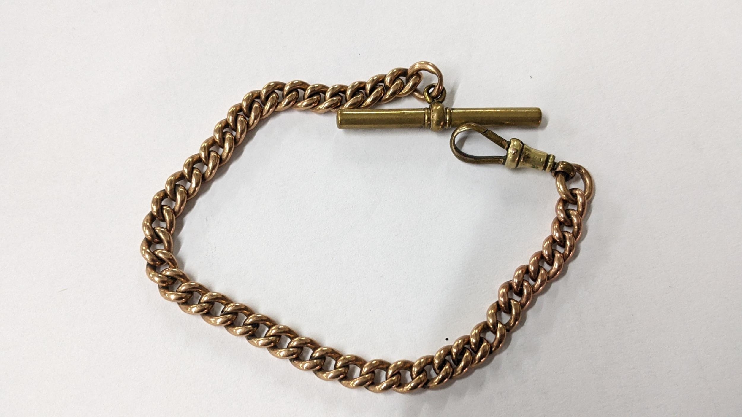 A 9ct rose gold pocket watch chain with a metal bulldog clip and T-bar, weight excluding bulldog