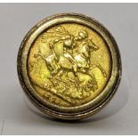 A 1871 full sovereign, mounted in a 9ct gold ring, total weight 17.3g Location: