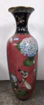 A large Japanese cloisonne enamelled floor vase, decorated with a bird perched amongst blossoming
