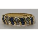 An 18ct gold diamond and sapphire ring 4.4g Location: