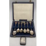 Mixed silver to include a vesta case having a floral engraved detail, along with a set of six silver