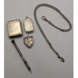 Mixed silver items to include a pocket watch chain and bulldog clip, two vesta cases, a silver