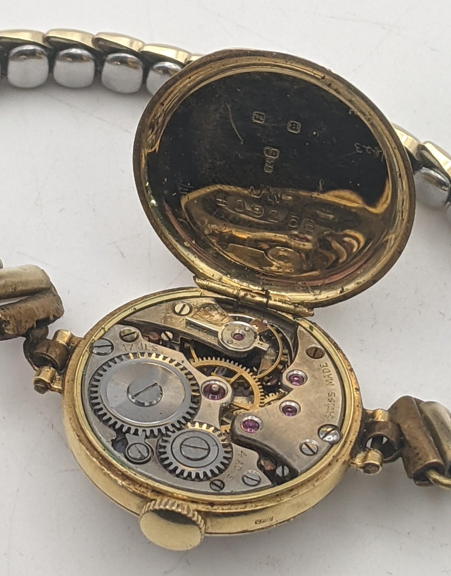 An early 20th century 18ct gold ladies manual wind wristwatch with a later expanding strap, total - Image 2 of 3
