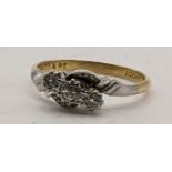 An 18ct gold and platinum three stone diamond ring 2.8g Location: