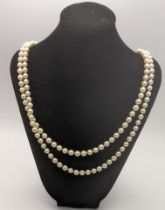 A double string pear necklace set with a 18ct gold clasp 56cmL Location: