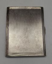 A silver D.Bros cigarette case having an engine turned design, hallmarked Birmingham 1937, 179.9g