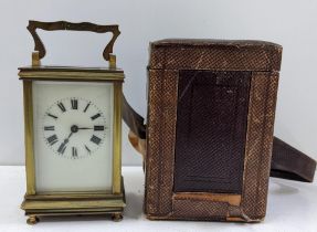 An early 20th century gilt metal 8-day carriage clock in a fitted travel case Location: