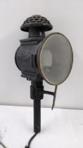 A late 19th/early 20th century black painted tin carriage lamp Location: