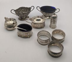 A set of three silver pierced condiments, together with a pair of William Hutton & Sons Ltd silver