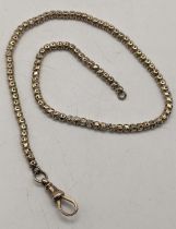 A yellow metal pocket watch chain tested as 9ct gold 27cm long, with a 9ct gold bulldog clip,