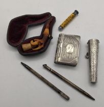 A mixed lot of smoking related items to include a Victorian silver cheroot holder having a floral