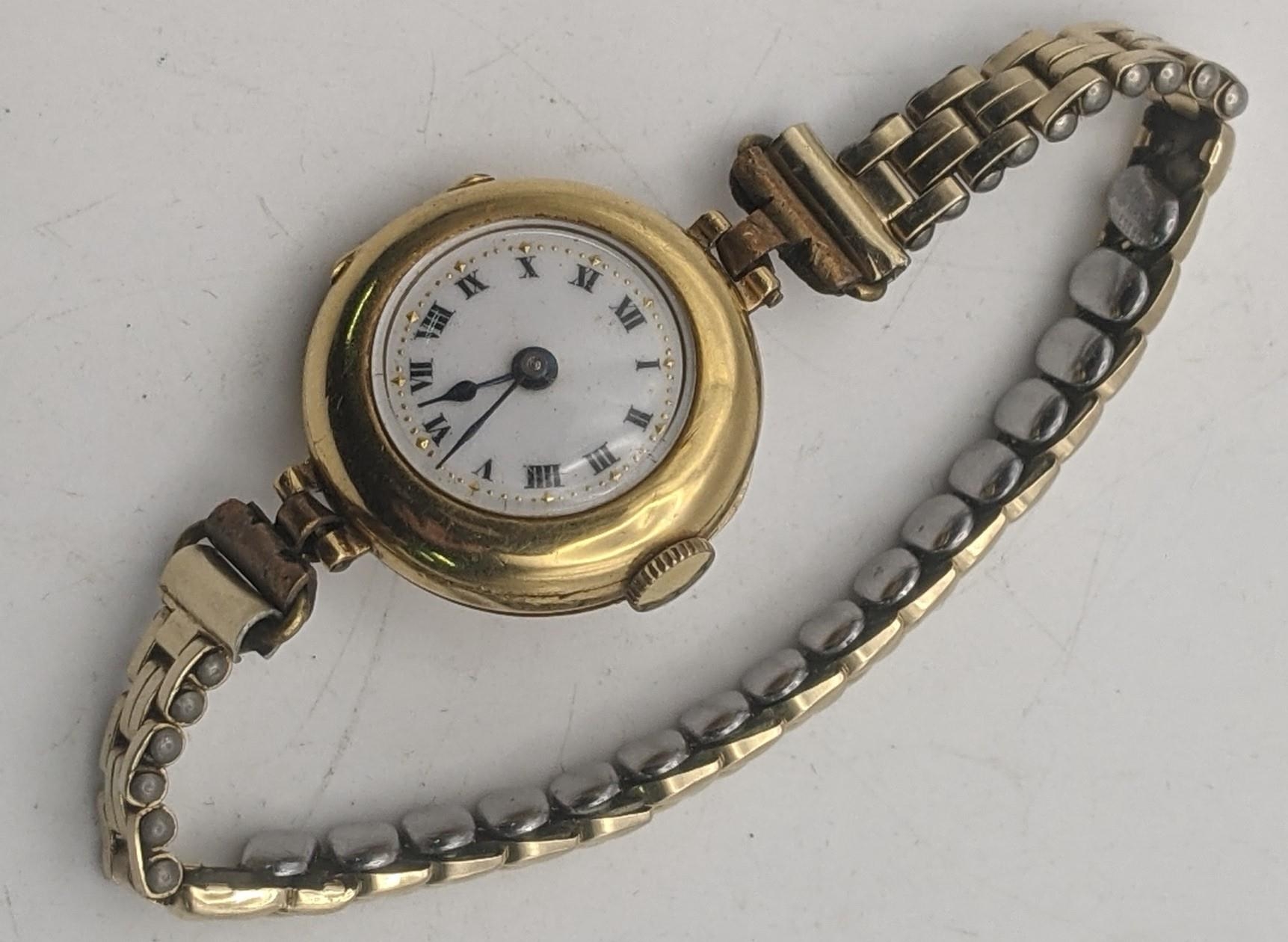 An early 20th century 18ct gold ladies manual wind wristwatch with a later expanding strap, total - Image 3 of 3