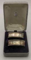A pair of silver napkin rings hallmarked London 1989 16.6g Location: