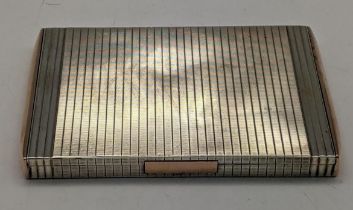 A sterling silver cigarette case having silver guilting to the top and bottom, 172.5g Location: