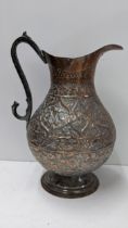 A Persian Qajar copper repousse jug 29.5cm h Location: