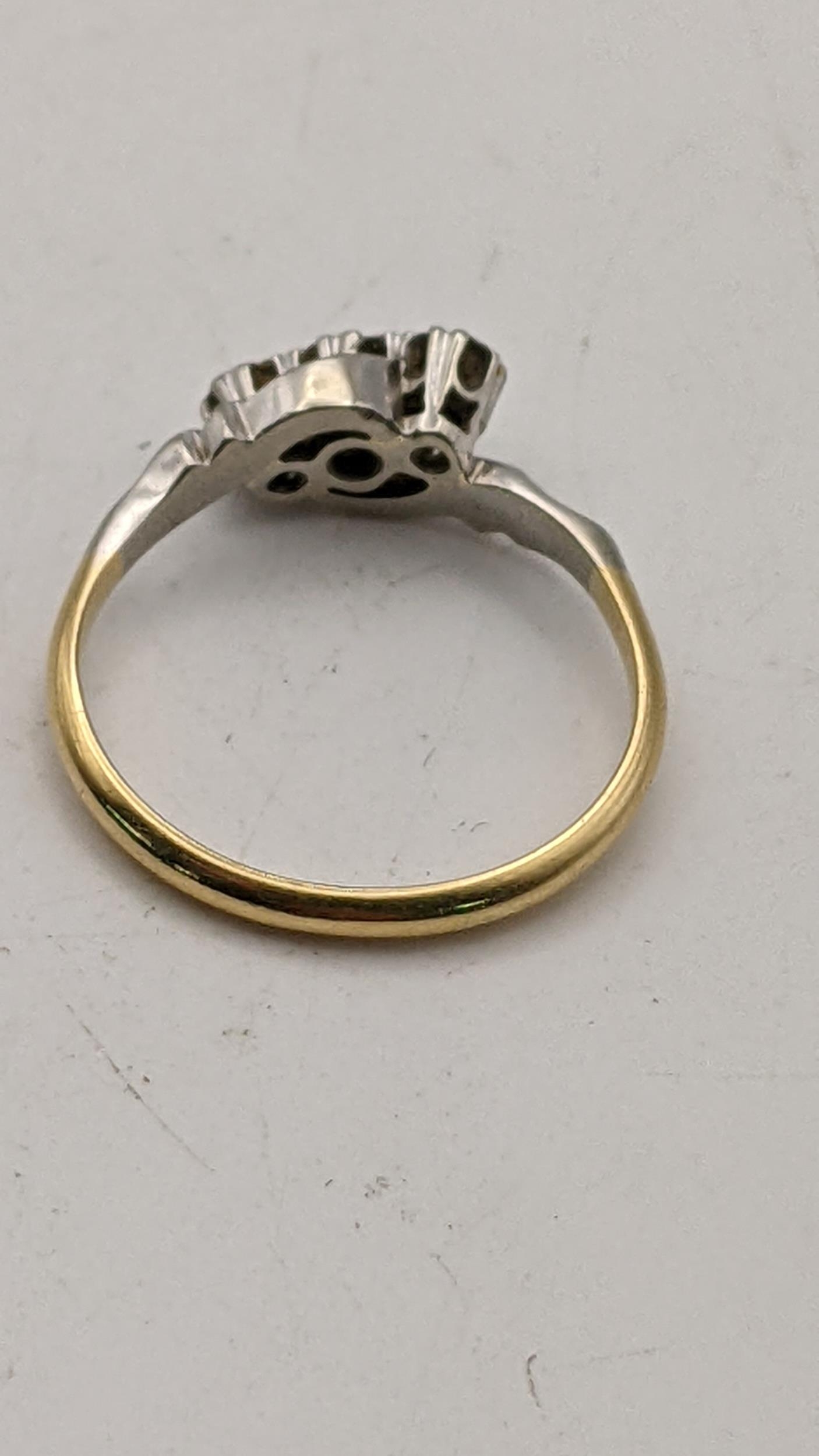 An 18ct gold and platinum three stone diamond ring 2.8g Location: - Image 2 of 2