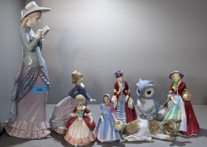 Two Lladro figures to include one of a lady reading a book 36cm h, together with a Lladro cow and
