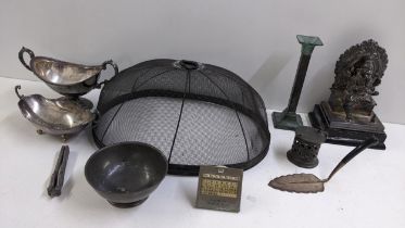A mixed lot to include a silver plated model of Ganesh, a desk calendar, Victorian Wirax food