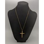 A 9ct gold cross pendant having a floral engraved design, on a 9ct gold box link necklace, 7.2g