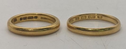 Two 22ct gold wedding bands, one size O, the other M 1/2, total weight 7.8g Location: