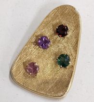 An 18ct gold pendant set with five different coloured stones 4.6g Location: