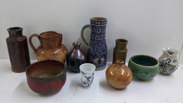 A mixed lot to include an Iznik terracotta jug, mixed studio pottery, two marble models of elephants