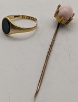 An 18ct gold and bloodstone signet ring A/F 3.2g, together with a yellow metal stick pin tested as