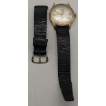A 9ct gold gent's Garrard automatic wristwatch on a black leather strap A/F, total weight 37.4g