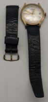 A 9ct gold gent's Garrard automatic wristwatch on a black leather strap A/F, total weight 37.4g