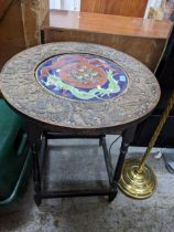 An Anglo-Oriental occasional table, early 20th century, the carved and ebonized table with