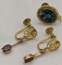 A pair of 14ct gold earrings set with a red coloured stone 2.9g together with a gold and opal