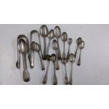 19th century and later silver to include various spoons, and sugar tongs, total weight 34.5g