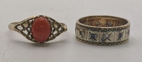 A 9ct gold ring set with a central oval shaped coral, size R, 1.8g, together with a two tone band