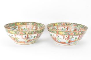 A pair of Chinese export late 19th century Canton Famille Rose porcelain bowls, in polychrome