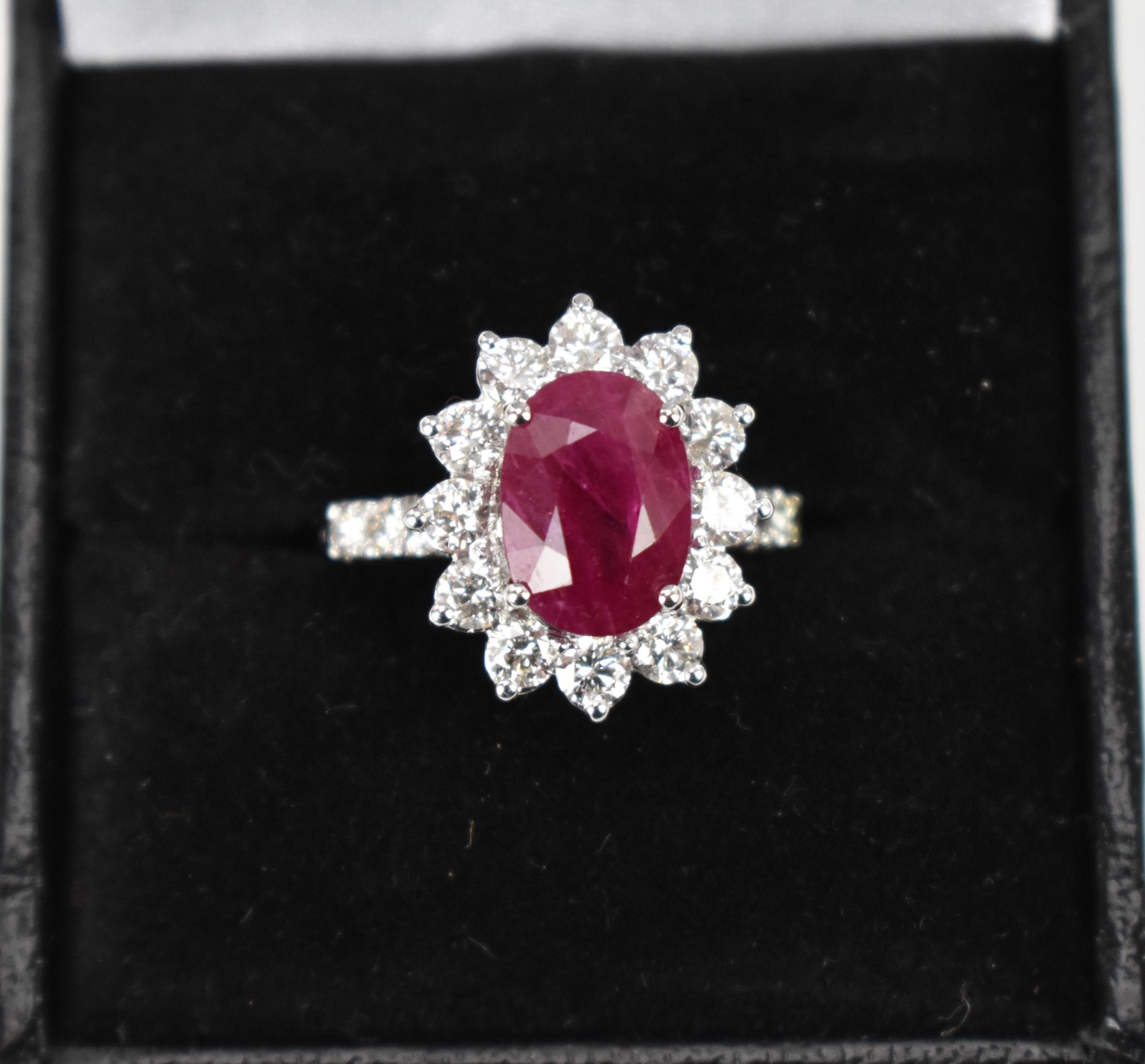An 18ct white gold, diamond and ruby dress ring, set with central oval mixed cut ruby in four claw - Bild 10 aus 12